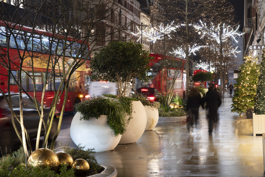 Sloane Street: lit planters and tree lights along Sloane Street, London