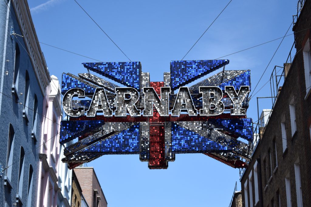 Deconstructed Union Flag: glittering Carnaby Union Flag sign above Carnaby Street, London