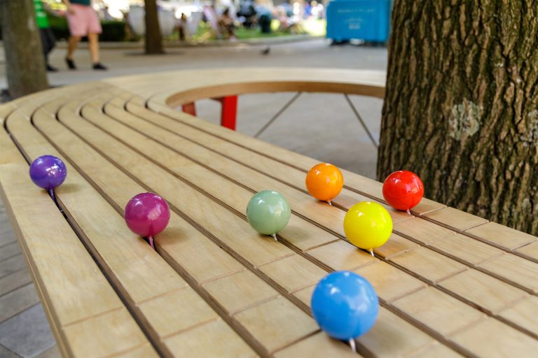 On Track Bench: colourful ball sculptures on a bench in Brindley Place, Birmingham