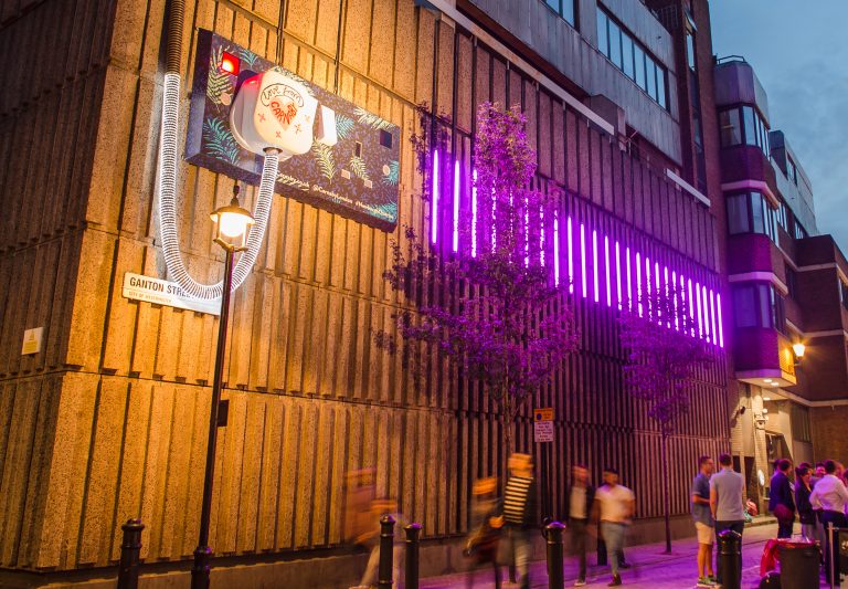Plug & Socket: giant illuminated plug and pink neon on Ganton Street, London