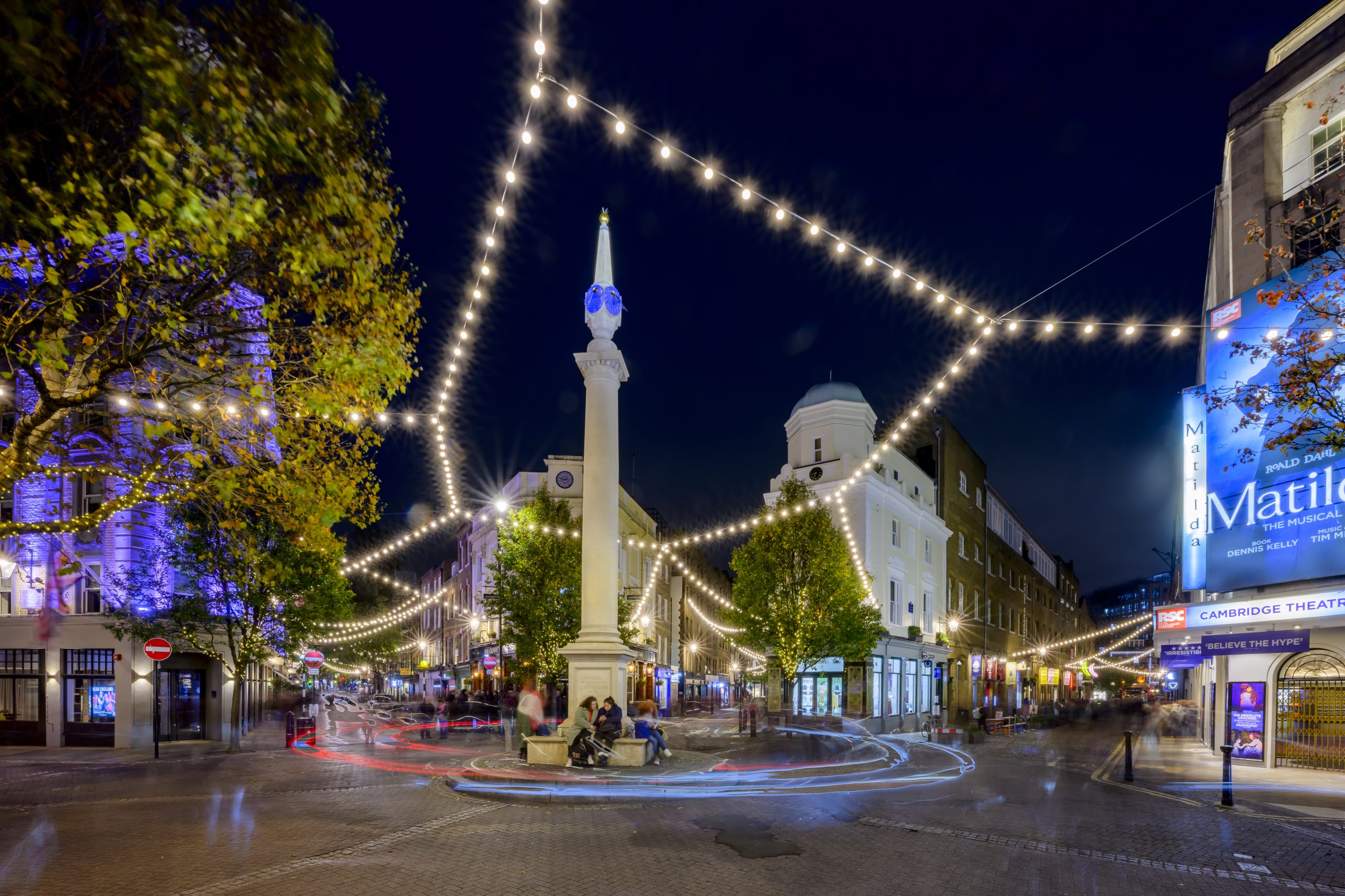Seven Dials Festoon: star-shaped festoon lights around the Seven Dials sundial pillar, London
