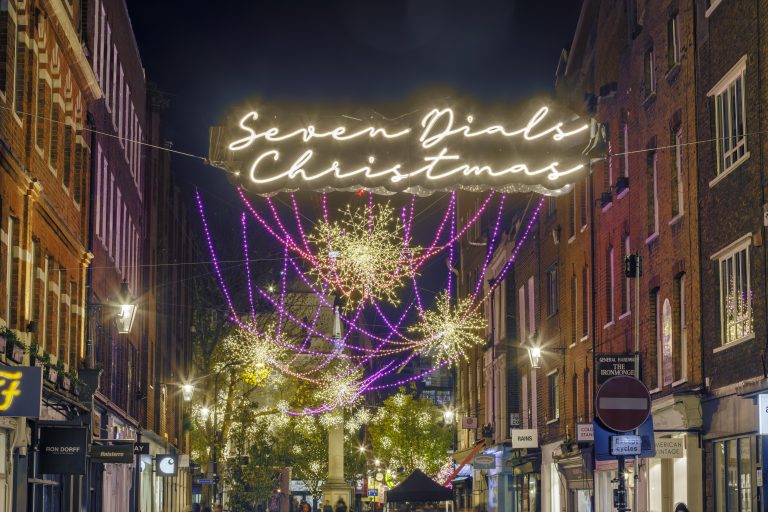 Christmas Comets: Seven Dials Christmas sign and golden comet lights, London