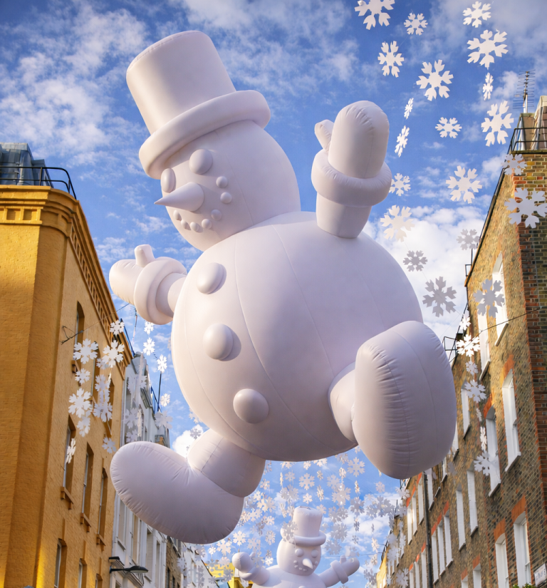 Carnaby Snowmen: giant inflatable snowman above Carnaby Street, London