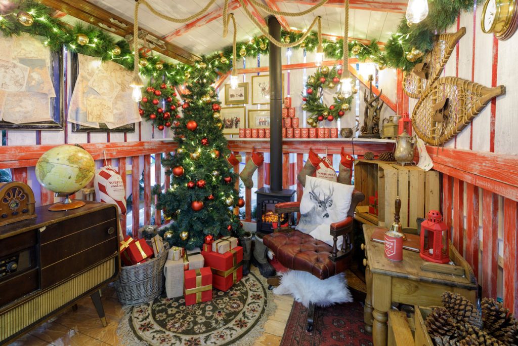 North Pole At Lion Yard: Santa's cabin grotto with Christmas tree, Cambridge