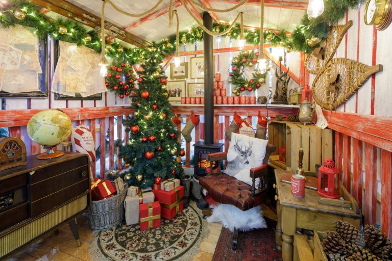 North Pole At Lion Yard: Santa's cabin grotto with Christmas tree, Cambridge