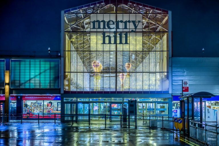 The Flight Before Christmas: Merry Hill shopping centre entrance lit for Christmas, Dudley