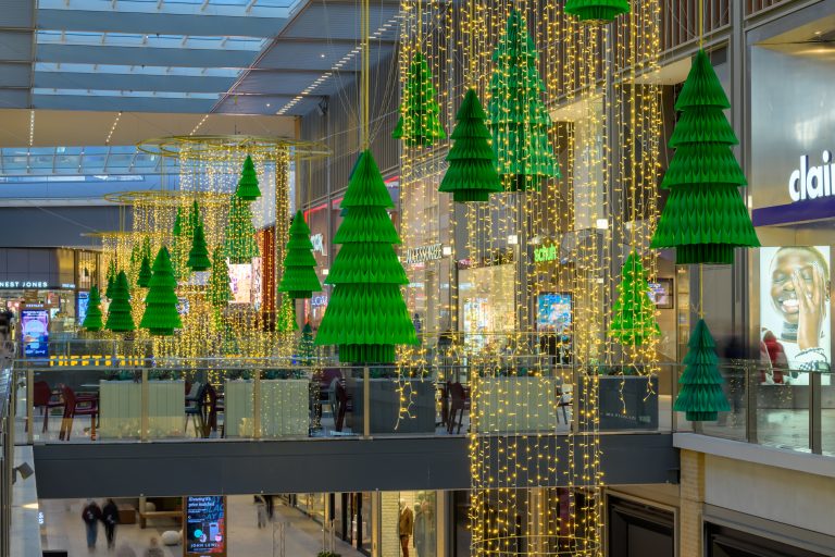 Festive Forest: hanging green Christmas tree sculptures and light curtains in Westgate, Oxford